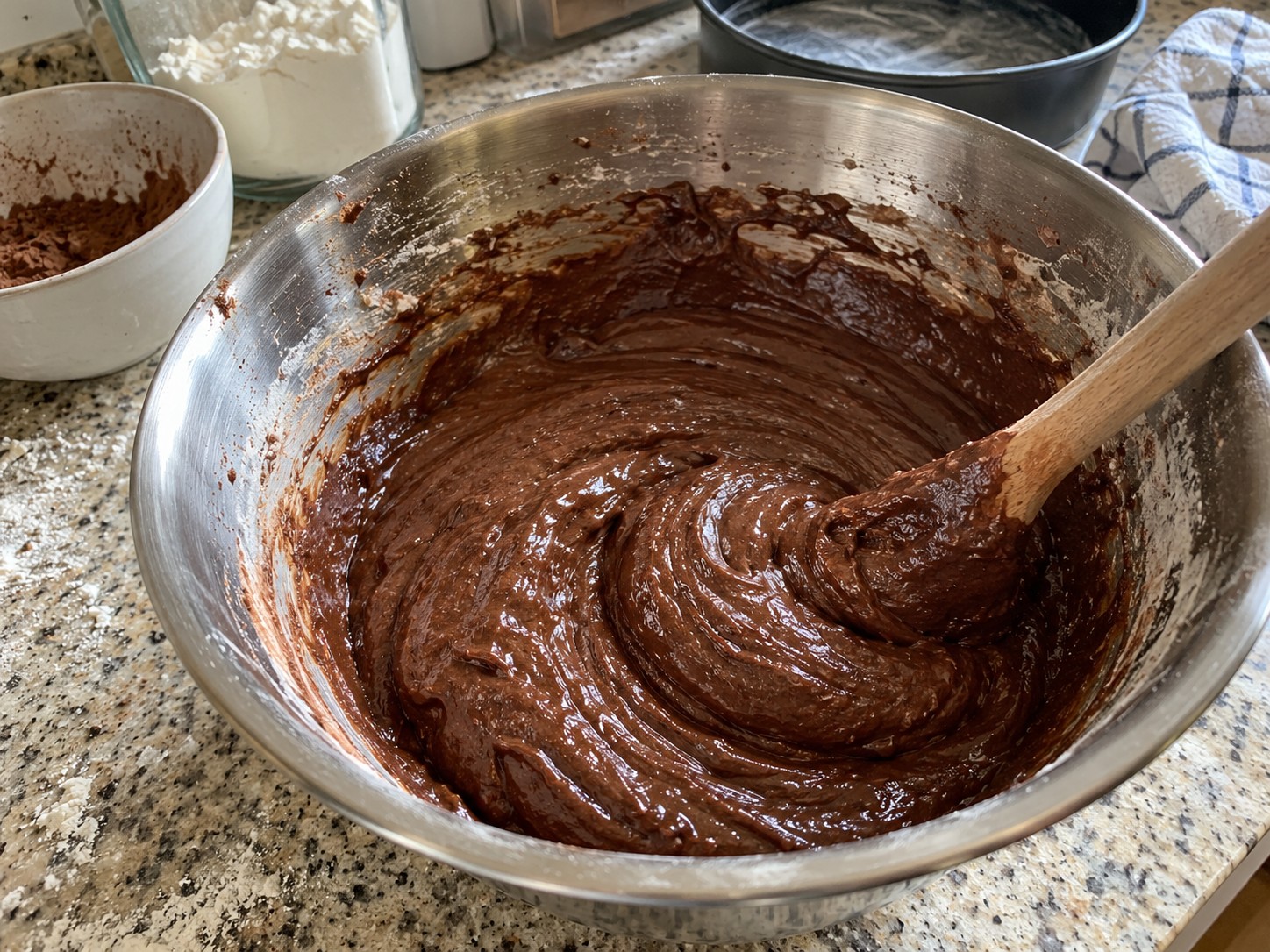 Easy chocolate cake batter mixed in a home kitchen bowl